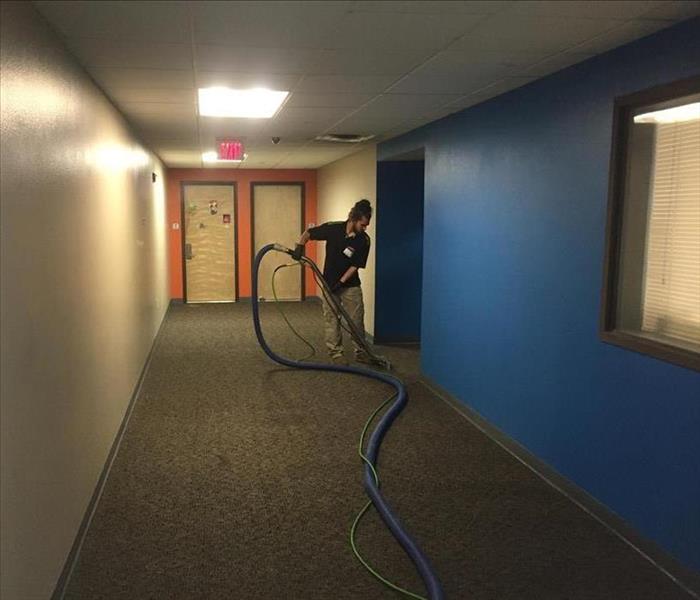 SERVPRO employee vacuuming water